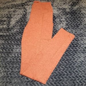 Reddish/pink leggings